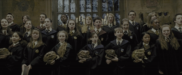 Wide shot frame from Harry Potter and the Prisoner of Azkaban — standing, room, glass