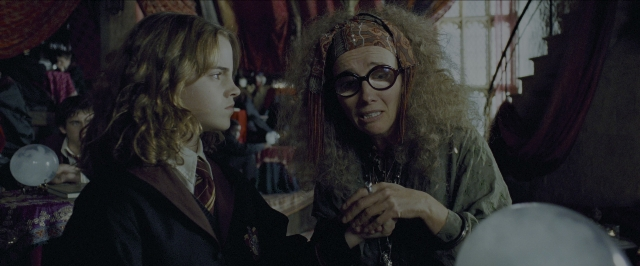 Wide shot frame from Harry Potter and the Prisoner of Azkaban — standing, room, hand