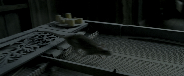 Wide shot frame from Harry Potter and the Prisoner of Azkaban — plate, table, bird