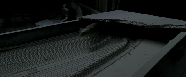 Wide shot frame from Harry Potter and the Prisoner of Azkaban — sitting, table, animal