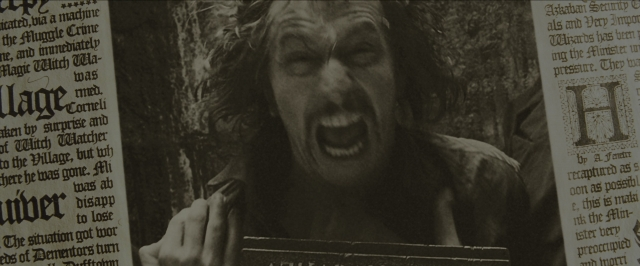 Medium shot frame from Harry Potter and the Prisoner of Azkaban — book, coat, beard