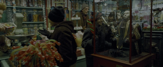Wide shot frame from Harry Potter and the Prisoner of Azkaban — standing, person, human face