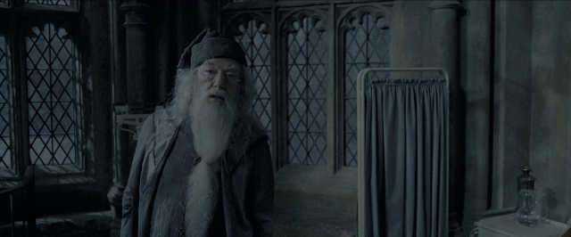Wide shot frame from Harry Potter and the Prisoner of Azkaban — standing, room, table