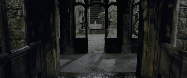 Medium shot frame from Harry Potter and the Prisoner of Azkaban — standing, person, building