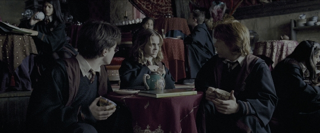 Medium shot frame from Harry Potter and the Prisoner of Azkaban — sitting, book, room