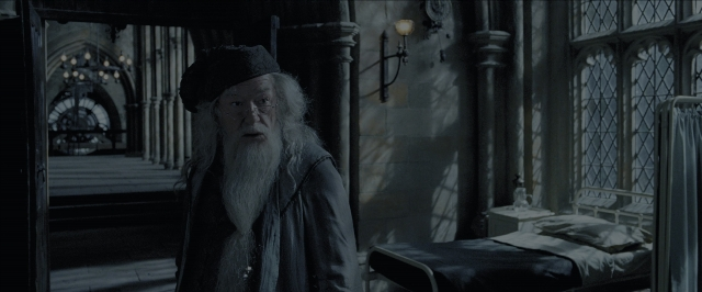 Wide shot frame from Harry Potter and the Prisoner of Azkaban — standing, room, bed