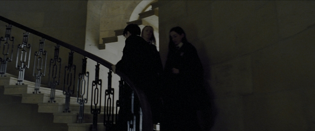Wide shot frame from Harry Potter and the Prisoner of Azkaban — standing, night, person