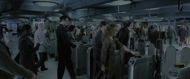 Wide shot frame from Harry Potter and the Order of the Phoenix — standing, walking, coat
