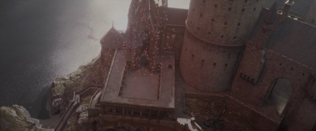 Wide shot frame from Harry Potter and the Order of the Phoenix — walking, water, castle