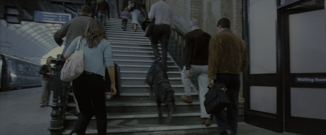Wide shot frame from Harry Potter and the Order of the Phoenix — walking, room, train