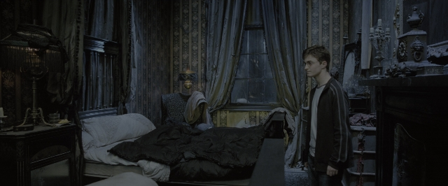 Wide shot frame from Harry Potter and the Order of the Phoenix — standing, room, bed
