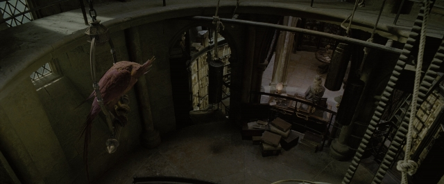 Wide shot frame from Harry Potter and the Order of the Phoenix — sitting, room, table