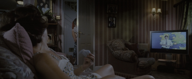 Wide shot frame from Harry Potter and the Order of the Phoenix — sitting, room, table
