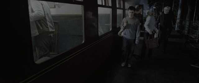 Wide shot frame from Harry Potter and the Order of the Phoenix — standing, train, person