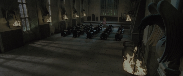Wide shot frame from Harry Potter and the Order of the Phoenix — sitting, room, dialogue
