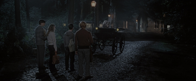 Wide shot frame from Harry Potter and the Order of the Phoenix — sitting, standing, dialogue