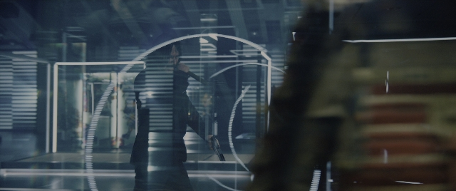 Wide shot frame from John Wick: Chapter 4 — walking, door, hand