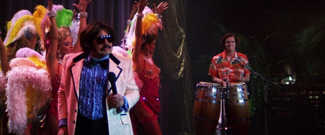 Wide shot frame from Man on the Moon — standing, suit, dress