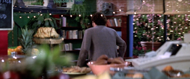Wide shot frame from Man on the Moon — book, standing, plate