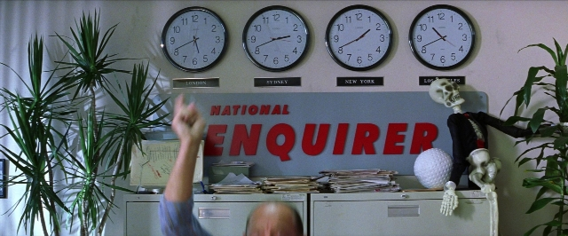 Wide shot frame from Man on the Moon — room, hand, clock