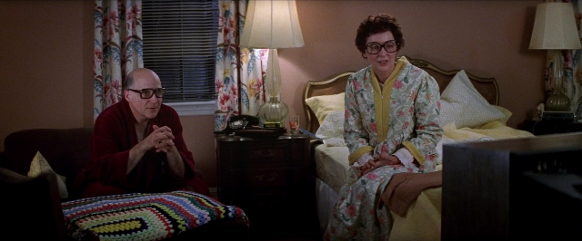 Wide shot frame from Man on the Moon — sitting, room, dialogue