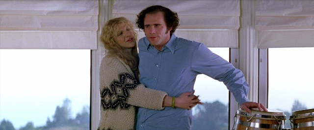 Wide shot frame from Man on the Moon — standing, hand, shirt