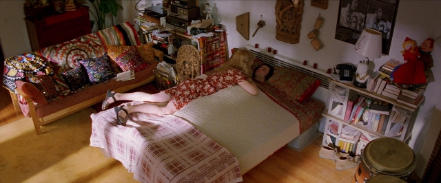 Wide shot frame from Man on the Moon — room, bed, house