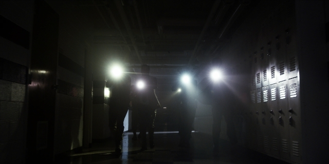 Wide shot frame from Stranger Things — walking, person, running