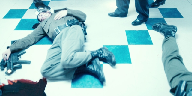 Frame from Stranger Things — standing, hand, suit