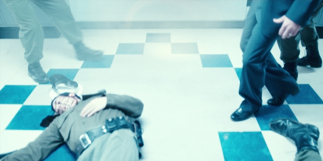 Wide shot frame from Stranger Things — standing, hand, face