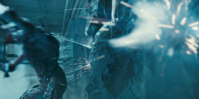Wide shot frame from Stranger Things — standing, room, hand
