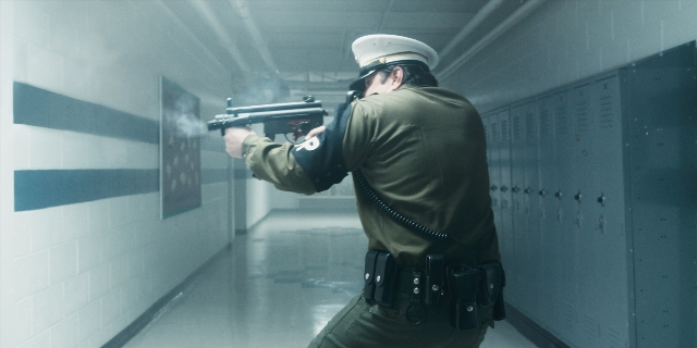 Wide shot frame from Stranger Things — standing, hat, uniform
