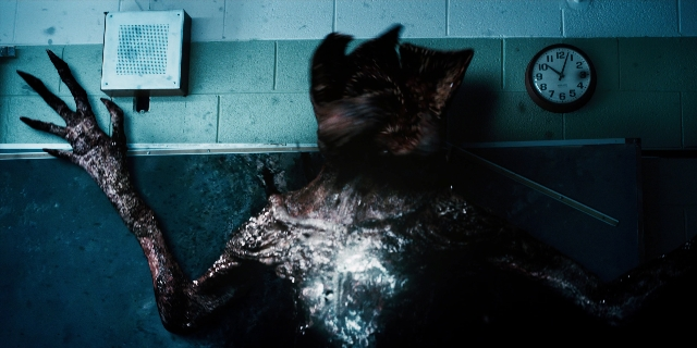 Wide shot frame from Stranger Things — animal, clock, cat