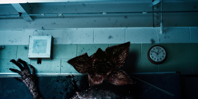 Wide shot frame from Stranger Things — room, animal, water