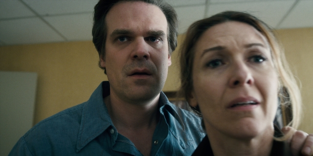 Close-up frame from Stranger Things — standing, room, office