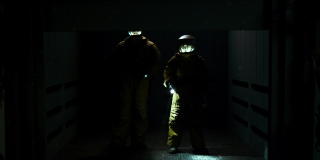 Wide shot frame from Stranger Things — standing, door, person