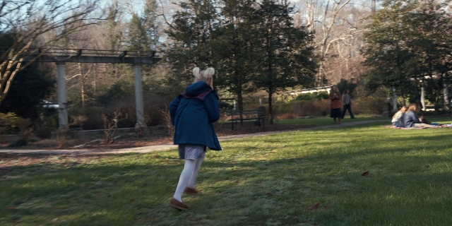 Wide shot frame from Stranger Things — sitting, standing, walking