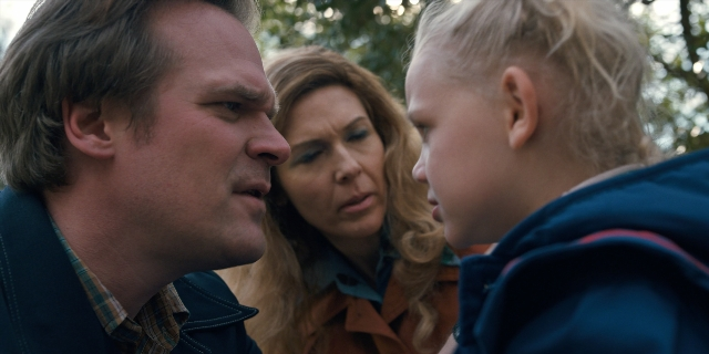 Wide shot frame from Stranger Things — standing, face, hair