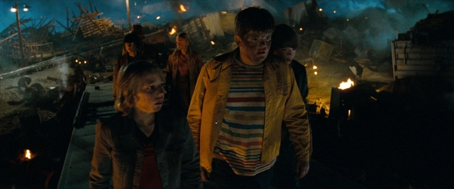 Wide shot frame from Super 8 — people, action, standing