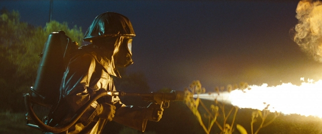 Frame from Super 8 — hat, suit, night