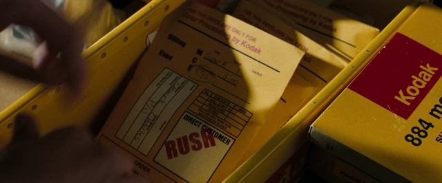 Frame from Super 8 — table, hand, box