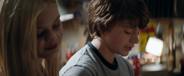 Frame from Super 8 — kitchen, hand, shirt