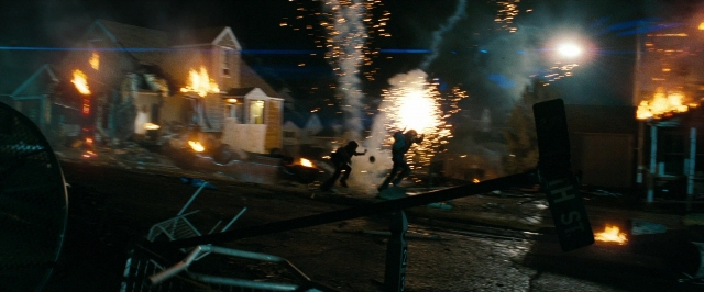 Frame from Super 8 — standing, street, fire