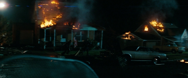 Frame from Super 8 — street, fire, car