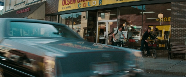Frame from Super 8 — walking, street, car