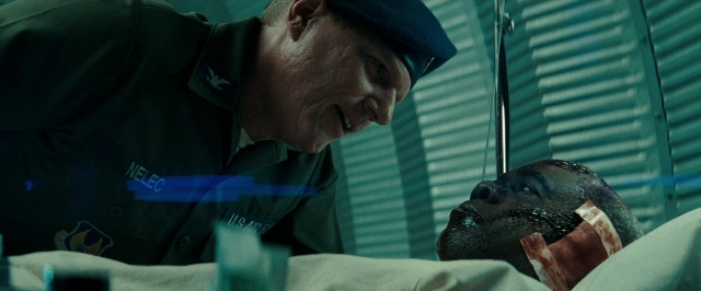 Frame from Super 8 — standing, room, bed
