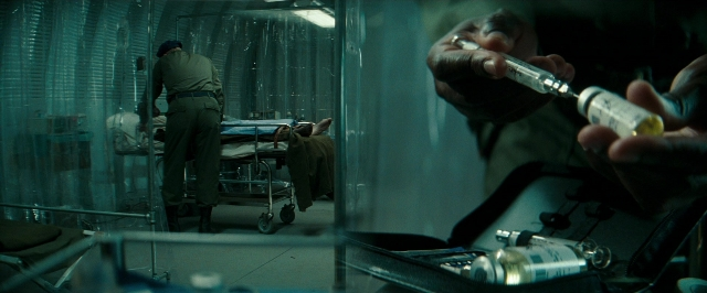 Frame from Super 8 — standing, room, bed