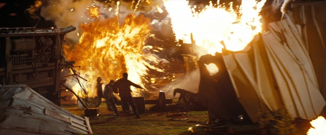 Frame from Super 8 — standing, fire, smoke