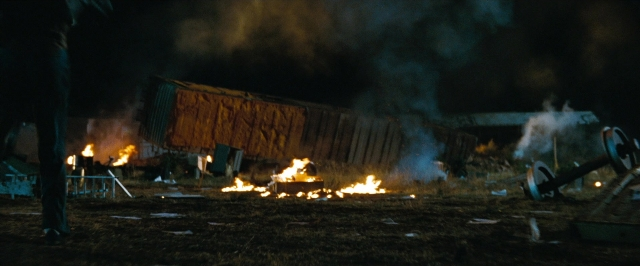 Wide shot frame from Super 8 — fire, night, smoke