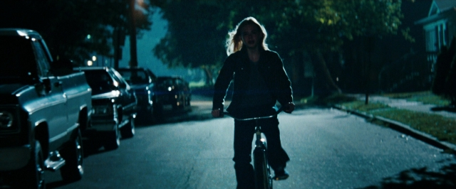 Wide shot frame from Super 8 — street, car, night